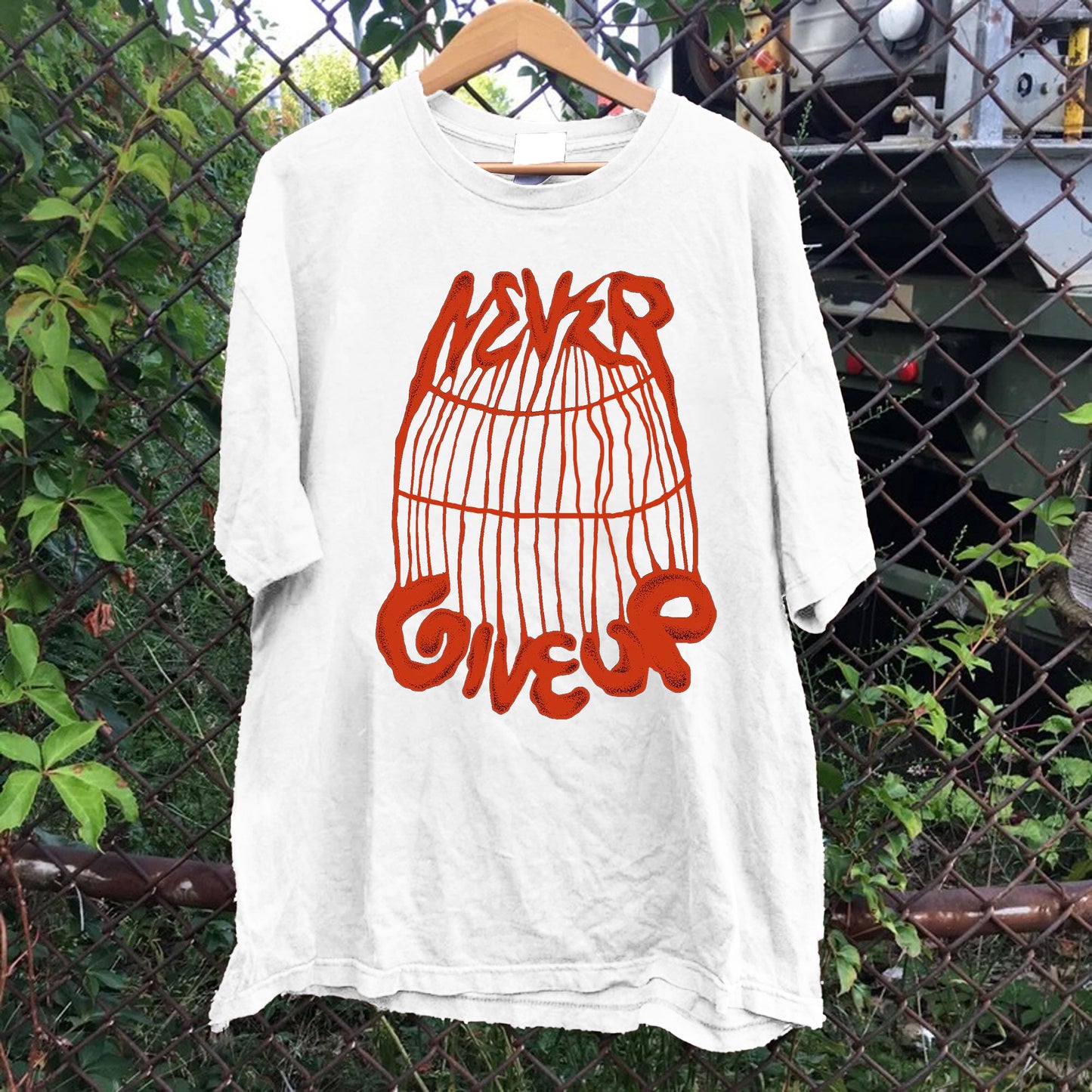 Never Give Up Cage Tee
